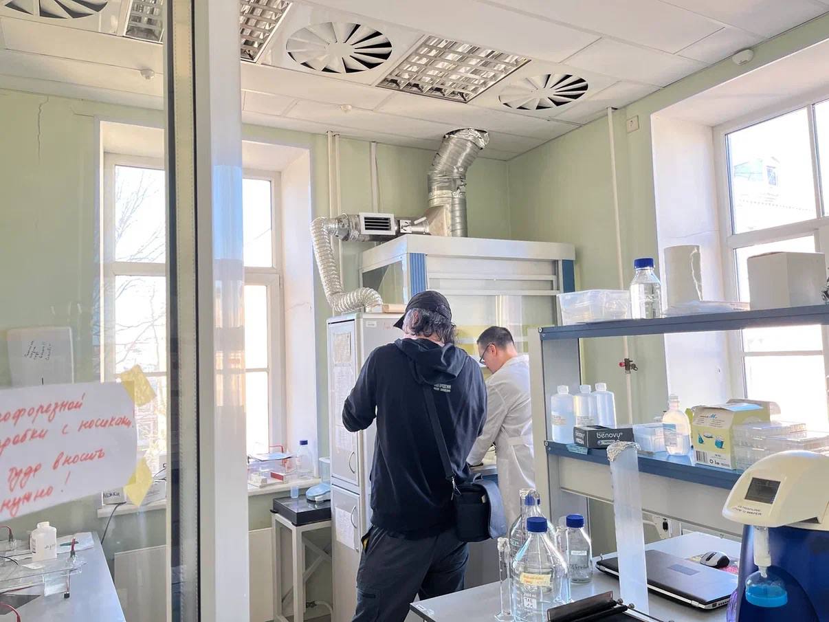 The film crew working in a laboratory